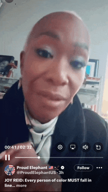 a video of a bald woman is being played on a phone