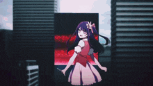 a girl in a pink dress is standing in front of a screen