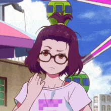 a girl wearing glasses and a t-shirt with a purple square on it
