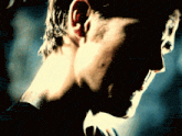 a close up of a man 's ear and neck