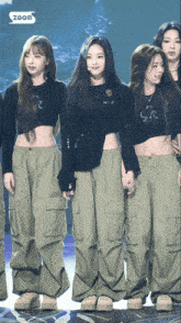a group of women standing next to each other with the word zoom in the corner