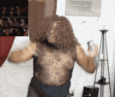 a woman with curly hair is dancing in a room
