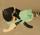 a cartoon character with green hair is laying on the ground in the rain .