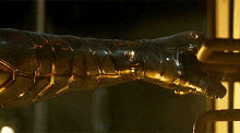 a close up of a person 's arm with armor on