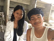 a man and a woman pose for a picture together