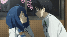 a boy and a girl are looking at each other in front of a window
