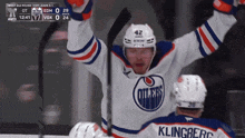 a hockey player with the number 42 on his helmet