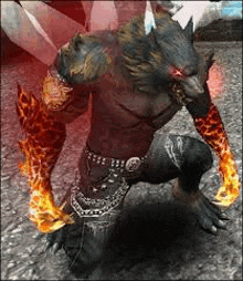 a werewolf is kneeling down with fire coming out of his hands and arms .