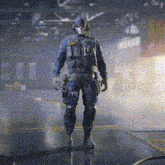 a man in a military uniform is standing in a dark room with a fire in the background .