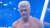 a shirtless man has a tattoo on his chest that says dream