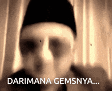 a blurry picture of a man with the words darimana gemsnya on the bottom