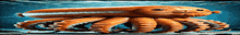 a giant orange octopus is swimming in the water