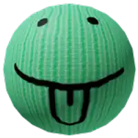a green ball with a smiley face and a tongue sticking out