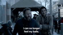 two men are standing next to each other and one of them says i can no longer feel my balls