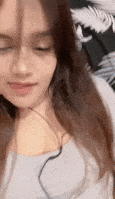 a close up of a woman 's face with headphones on
