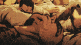 a group of men are laying on top of each other with their arms around each other