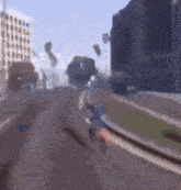a blurry picture of a person riding a bike down a road