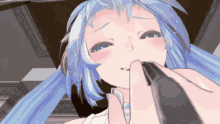 a close up of a girl 's face with blue hair