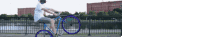 a man riding a bike with purple wheels
