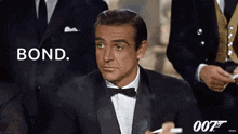 a man in a tuxedo is smoking a cigarette and says bond