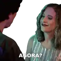 a man and a woman are looking at each other with the woman saying agora