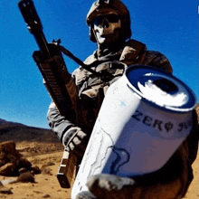a soldier holds a can of energy drink that says zero 5