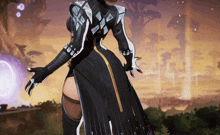 a woman in a black and gold outfit is standing with her arms outstretched in a video game