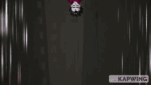a pixel art of a man laying upside down with kapwing in the bottom right corner