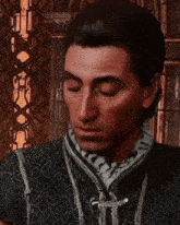 a close up of a man 's face with his hand on his neck
