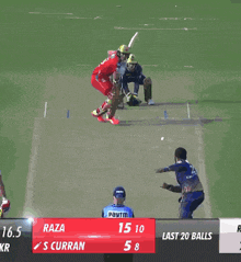 two cricket players are playing a game and one has raza on his jersey