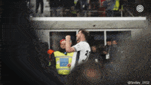 a blurred image of a soccer player with the number 3 on his shirt