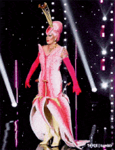 a drag queen wearing a pink flower costume