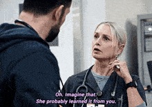 a man and a woman are talking in a hospital room and the woman is saying oh imagine that she probably learned it from you
