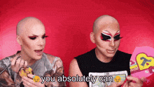 two drag queens with makeup on their faces and the words you absolutely can