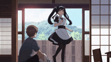 a girl in a maid outfit is standing next to a man in a blue shirt