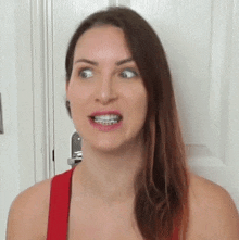 a woman with braces on her teeth is smiling