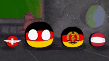a group of balls with flags on them are standing next to each other .