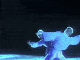 a person in a blue outfit is dancing on a stage