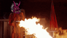 a pixel art drawing of a demon holding a gun