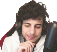a young man wearing headphones and a microphone is smiling