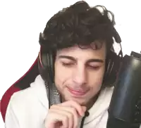 a young man wearing headphones and a microphone is smiling