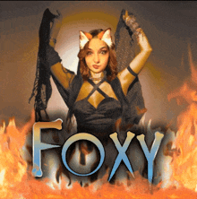 a woman in a fox costume is surrounded by fire and the word foxy