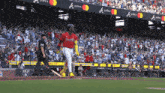 a baseball player wearing a red jersey with the letters a on it