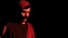 a man in a red outfit is saying i see the back of your balls
