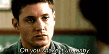 a man is talking to another man in a room and says `` oh you shake it up , baby . ''