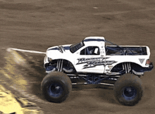 a white monster truck with the word rage on the side