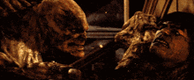 a man is being attacked by a monster in a room
