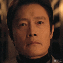 a close up of a man 's face with a netflix logo on the bottom