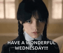 a girl in a school uniform is saying `` have a wonderful wednesday !! ''