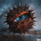 a picture of a blue eye in a spiky ball with pixiz written on the bottom right